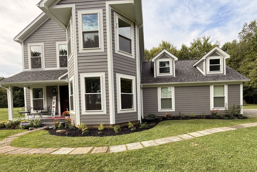 The finished front yard landscape spanning from door to driveway.