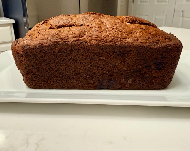 Banana bread loaf on a cutting board