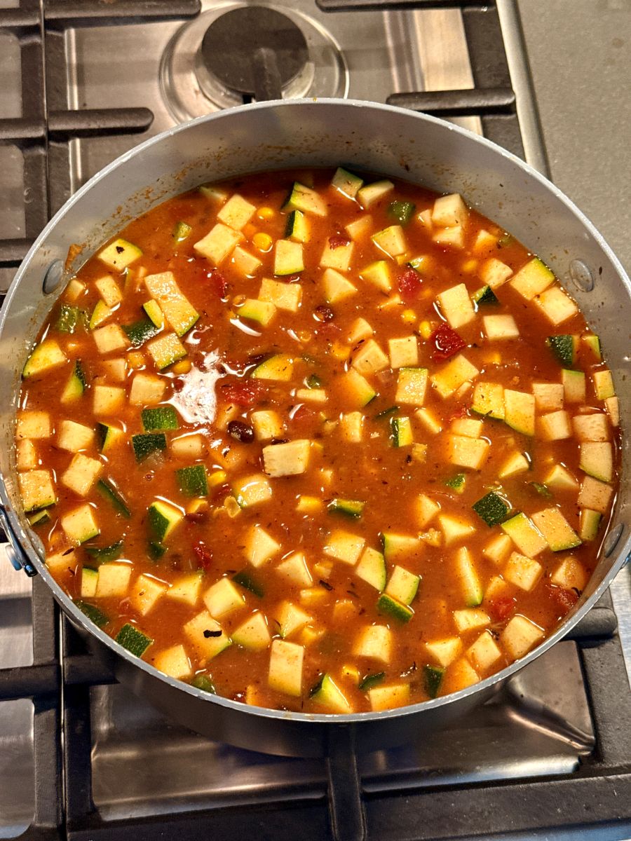 Smoky Adobo and Root Vegetable Bisque in a stock pot.